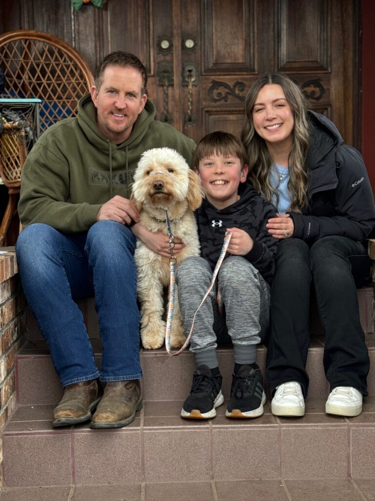 Owen-a-Doodle family with a Goldendoodle, representing the Guardian Home Program in Enumclaw, Washington